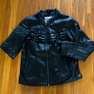 Leather Jacket,size L. Zipper. Black w/ruffles on front. Unique. Slash pockets